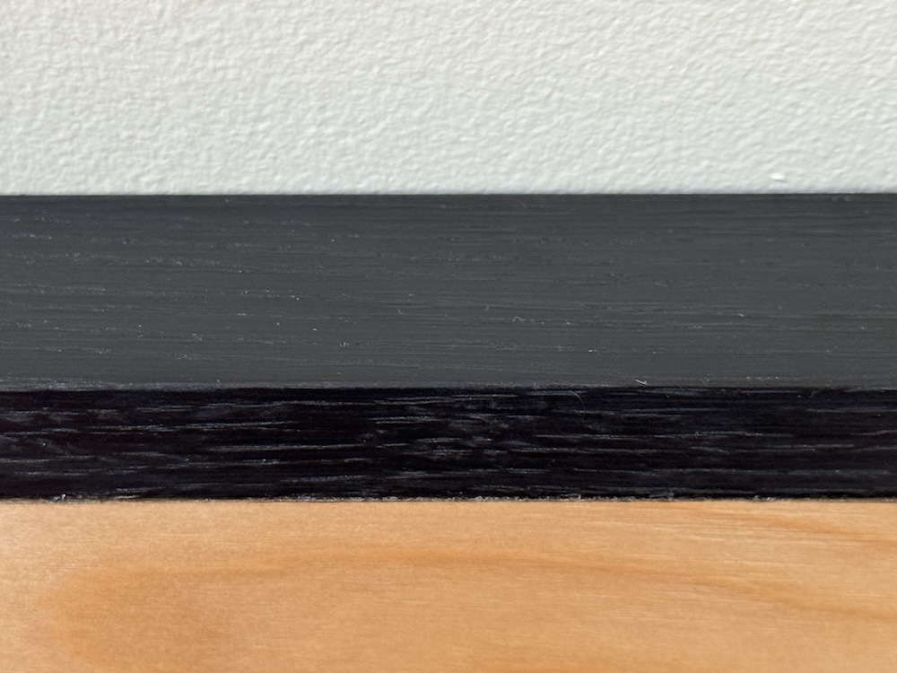 Close-up of the finished edge. The black is deep and consistent, even though the unfinished ebonized wood was not. The deep oak grain is still very much visible and tactile.